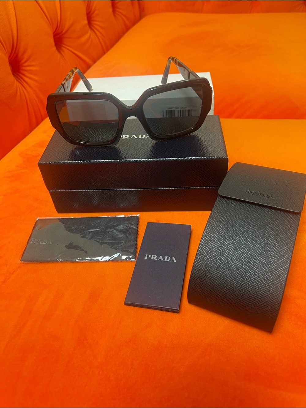Prada Black Sunglasses with Tortoise Temples and Polarized lenses